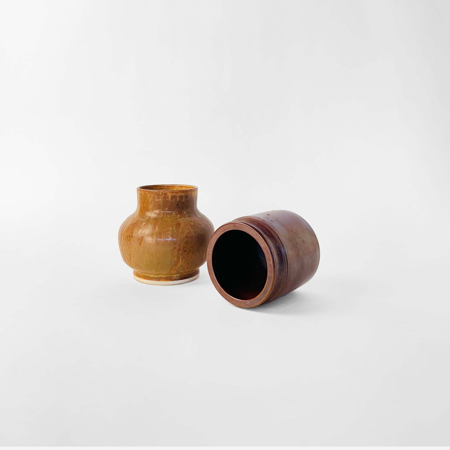 Wallåkra Dark Brown Vase, Made in Sweden. Paired with a California Pottery Vase in Light Brown.