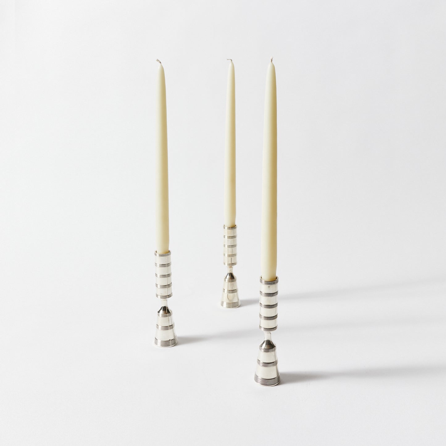 Set of Thirty Eight Silver Plated Pilar Candlesticks by Dansk