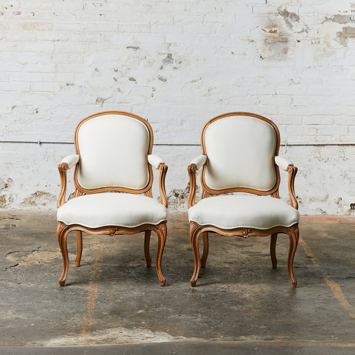 A Pair of Louis XV Style Arm Chairs