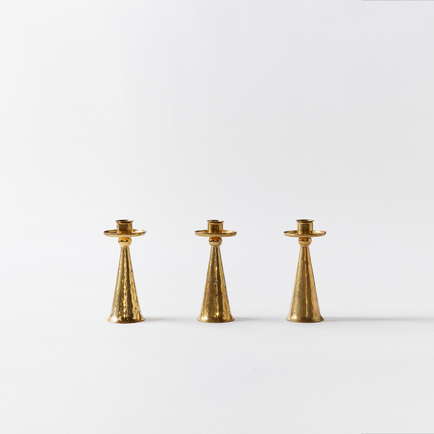 Set of Three Petite Candlesticks in Bronze