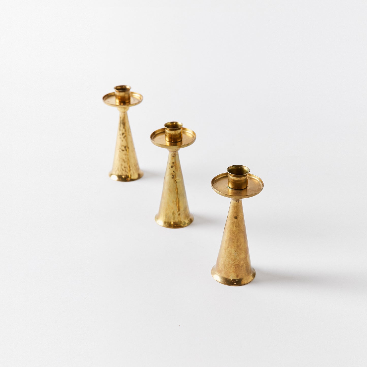 Set of Three Petite Candlesticks in Bronze